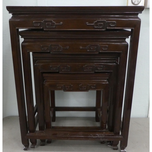 332 - A modern nesting set of four Chinese rosewood tables, raised on square, tapered legs  largest 2... 