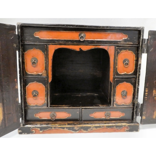 333 - An 18thC Chinese black lacquered and overpainted officials table top cabinet with two doors, decorat... 