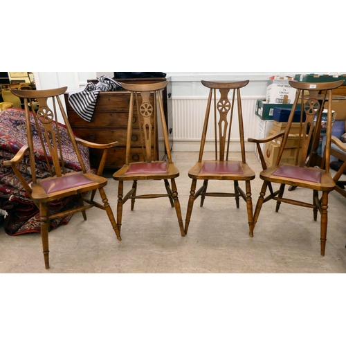 339 - A set of four mid 20thC stained beech framed dining chairs, each with a wheel splat and drop-in seat... 