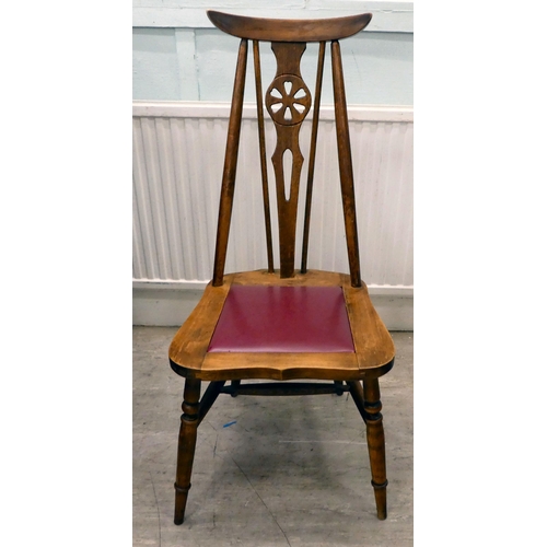 339 - A set of four mid 20thC stained beech framed dining chairs, each with a wheel splat and drop-in seat... 