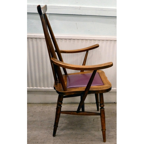 339 - A set of four mid 20thC stained beech framed dining chairs, each with a wheel splat and drop-in seat... 