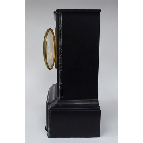 51 - A late 19thC black slate and mottled green marble cased mantel clock with straight sides, on a deep ... 