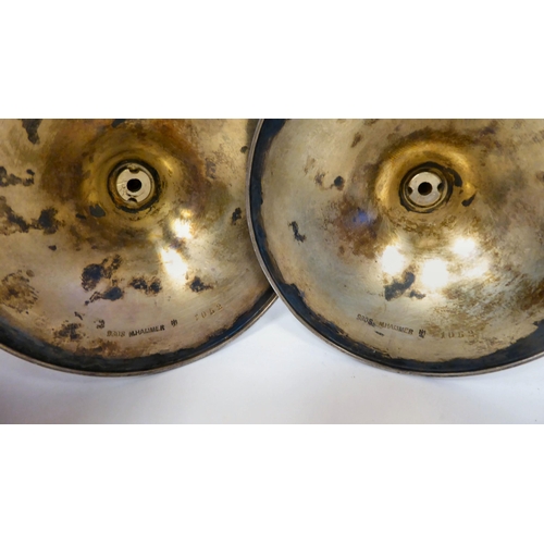 55 - A pair of Marius Hammer, Norwegian silver gilt and engine turned, powder blue enamel candlesticks wi... 