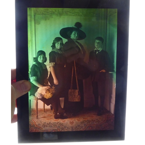 58 - Four French photographic plates, each depicting families in the late 19th/early 20thC  boxed