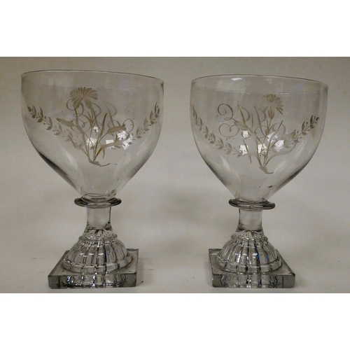 6 - A pair of late 18thC glass rummers, each with a monogrammed bowl, on a square foot  5.5