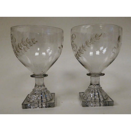 6 - A pair of late 18thC glass rummers, each with a monogrammed bowl, on a square foot  5.5