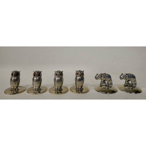 63 - A set of four silver owl menu holders  Sampson Mordan  Chester 1907; and a pair of later, ... 