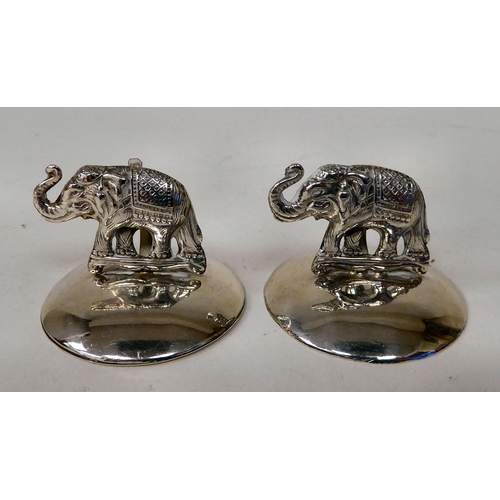 63 - A set of four silver owl menu holders  Sampson Mordan  Chester 1907; and a pair of later, ... 