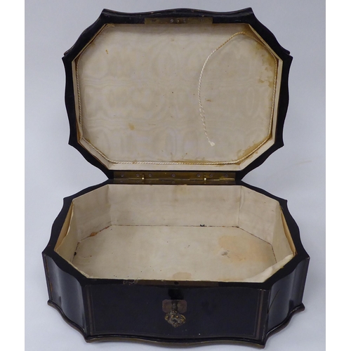 64 - A 19thC French black lacquered and boulleworked, serpentine outlined jewellery casket, the hinged li... 