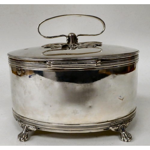 81 - A white metal oval biscuit box with a folding top handle and hinged lid, on claw feet  7.5