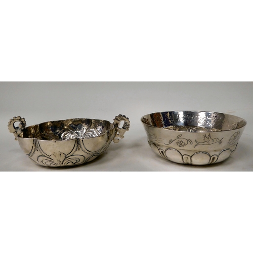 82 - A Mexican silver coloured metal bowl of lobed form, engraved with a frieze of flora and animals ... 