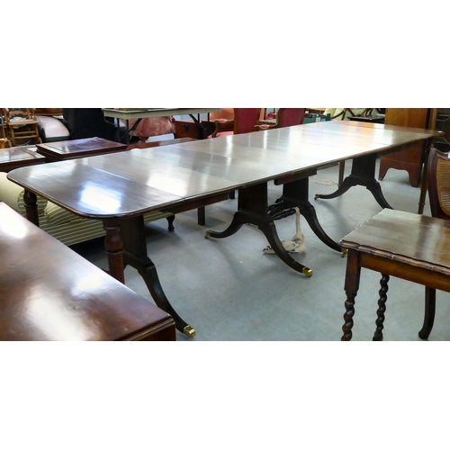 38 - A modern reproduction of a 19thC mahogany Pembroke style dining table with D-ends and four leaves, r... 