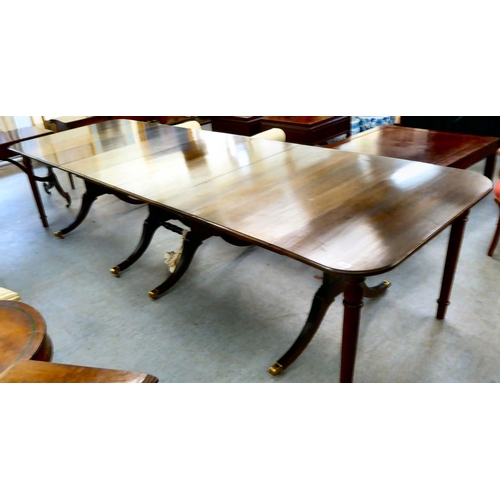 38 - A modern reproduction of a 19thC mahogany Pembroke style dining table with D-ends and four leaves, r... 