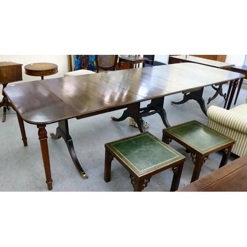 38 - A modern reproduction of a 19thC mahogany Pembroke style dining table with D-ends and four leaves, r... 