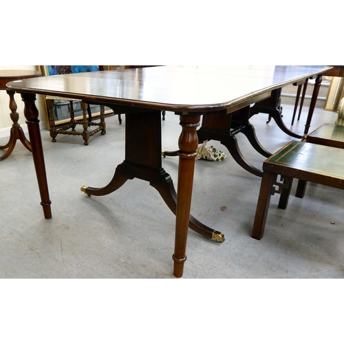 38 - A modern reproduction of a 19thC mahogany Pembroke style dining table with D-ends and four leaves, r... 