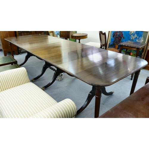 38 - A modern reproduction of a 19thC mahogany Pembroke style dining table with D-ends and four leaves, r... 