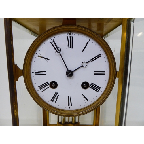 117 - A late 19thC French four glass brass cased mantel clock; the mercurial pendulum driven movement face... 