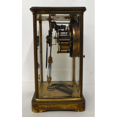 117 - A late 19thC French four glass brass cased mantel clock; the mercurial pendulum driven movement face... 