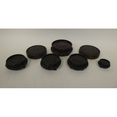 12 - Mixed collectables: to include a pair of 20thC Chinese carved fruitwood bottle coasters  6