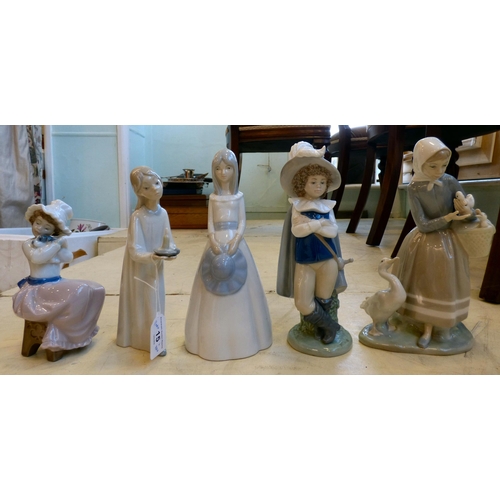 15 - Lladro and Nao porcelain figures: to include a girl, holding a candle  7