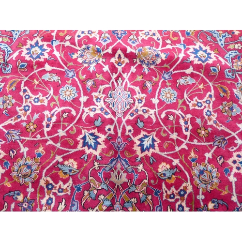 277 - A Persian Najafabad design carpet, decorated with trailing vines and floral patterns  126