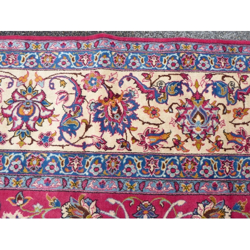 277 - A Persian Najafabad design carpet, decorated with trailing vines and floral patterns  126