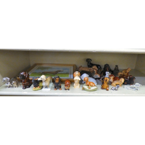 308 - Dachshund themed collectables: to include ceramic ornaments, in playful poses  largest 4