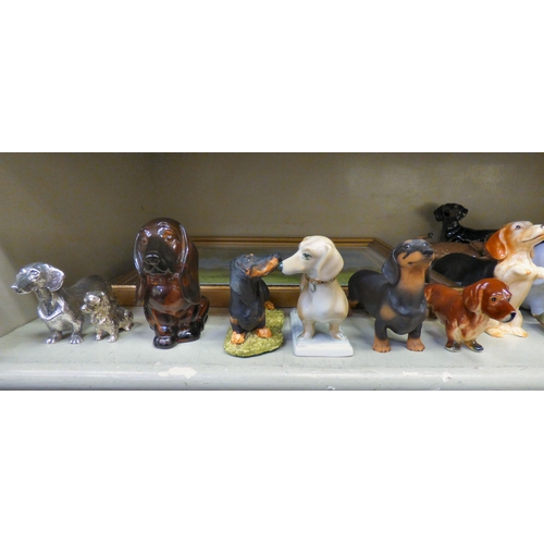 308 - Dachshund themed collectables: to include ceramic ornaments, in playful poses  largest 4