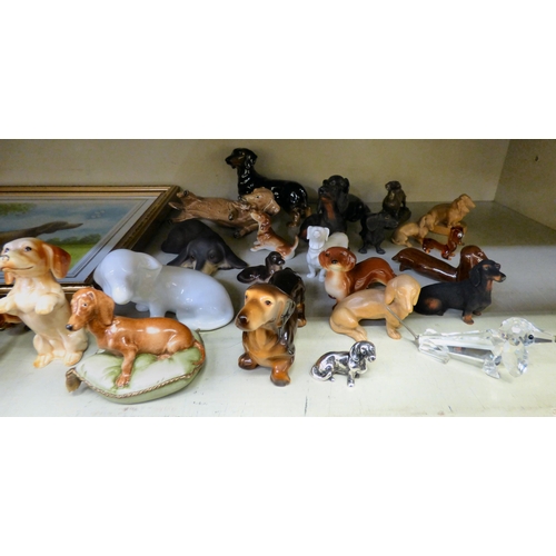 308 - Dachshund themed collectables: to include ceramic ornaments, in playful poses  largest 4