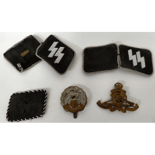 320 - World War II military issue items, viz. two pairs of unissued SS cotton patches; a Dutch SS Voluntee... 