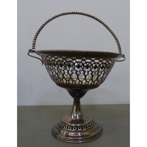 323 - 20thC metalware: to include a pair of Continental style silver plated comport stands  7