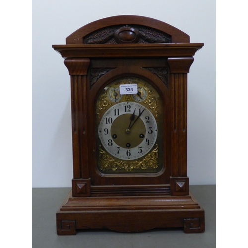 324 - An early 20thC Junghans mahogany cased mantel clock; the movement faced by an Arabic dial  18