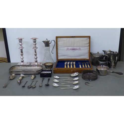 340 - A mixed lot: to include stainless steel teaware; a pair of Georgian style silver plated candlesticks... 