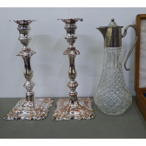 340 - A mixed lot: to include stainless steel teaware; a pair of Georgian style silver plated candlesticks... 