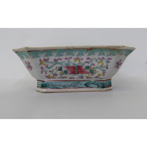 49 - A late 19thC Chinese porcelain shallow dish, decorated with flora, on a green ground  7