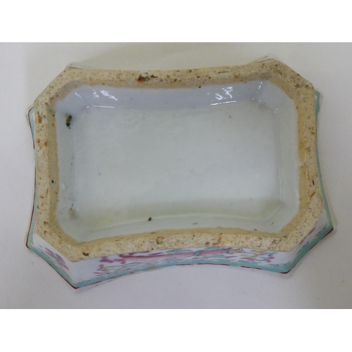 49 - A late 19thC Chinese porcelain shallow dish, decorated with flora, on a green ground  7