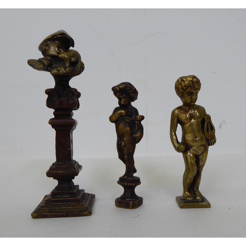 53 - 20thC collectables: to include two brass cherubic seals  3