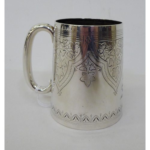 55 - A late Victorian silver mug  London 1891  (approx. weight 3.5ozs); and a loaded silver pin cushion s... 