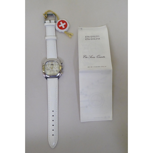 58 - A stainless steel cased Swiss made chronograph, on a white hide strap  cased