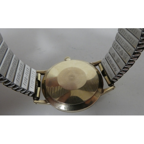 7 - A Smith Astral National.17 9ct gold cased manual wristwatch, faced by a baton and Arabic dial, on a ... 