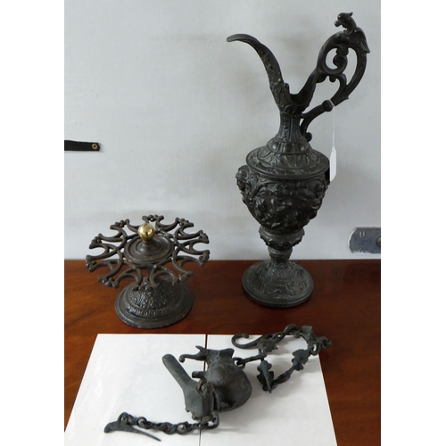 70 - 20thC cast iron items: to include a Continental inspired ewer