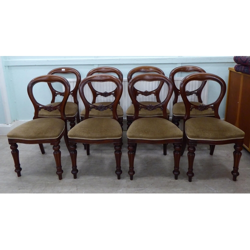 106 - A set of eight Victorian reproduction, mahogany framed, balloon back dining chairs, the brown fabric... 