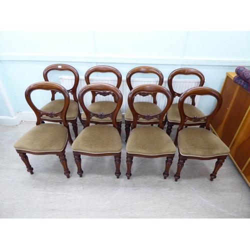 106 - A set of eight Victorian reproduction, mahogany framed, balloon back dining chairs, the brown fabric... 