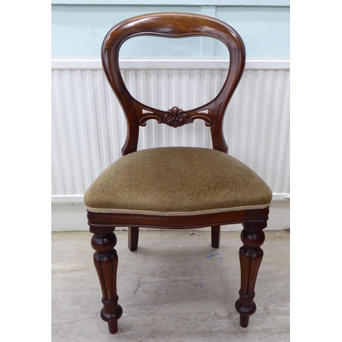 106 - A set of eight Victorian reproduction, mahogany framed, balloon back dining chairs, the brown fabric... 