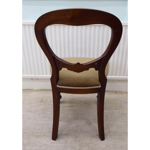 106 - A set of eight Victorian reproduction, mahogany framed, balloon back dining chairs, the brown fabric... 