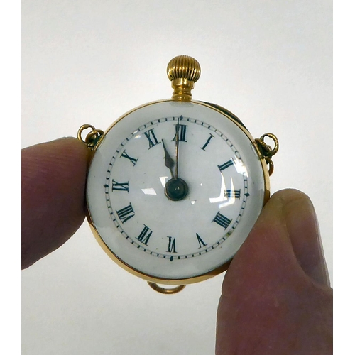 134 - An 18ct gold and glass, ball design watch, faced by an enamelled Roman dial 