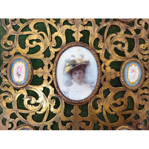 137 - A late 19thC green felt and brass clad folio set with a painted photographic portrait of a young lad... 