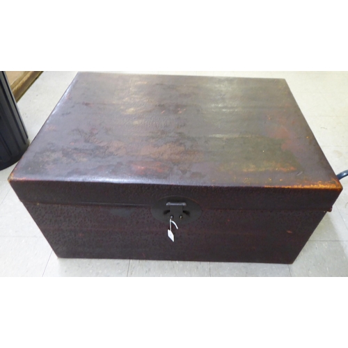 14 - An early/mid 20thC Chinese overpainted softwood chest with straight sides and a hinged lid  17