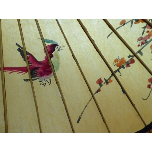 141 - Two 20thC Oriental handpainted paper parasols