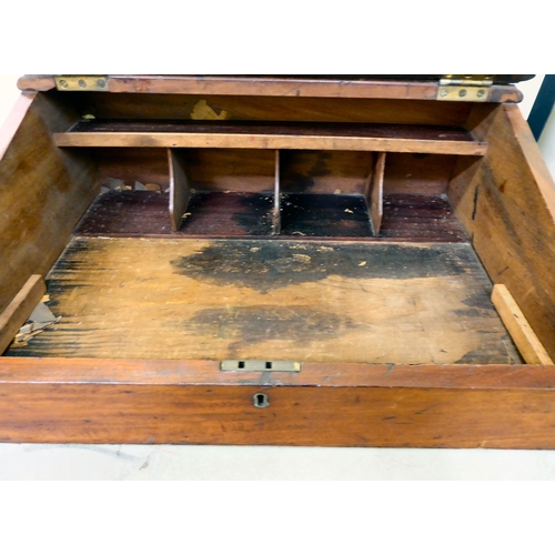 15 - A late Victorian mahogany clerk's desk with a hinged front, enclosing a pigeonhole and open section ... 